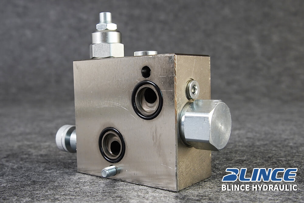 hydraulic flow control valve block with cartridge ports for speed control troubleshooting