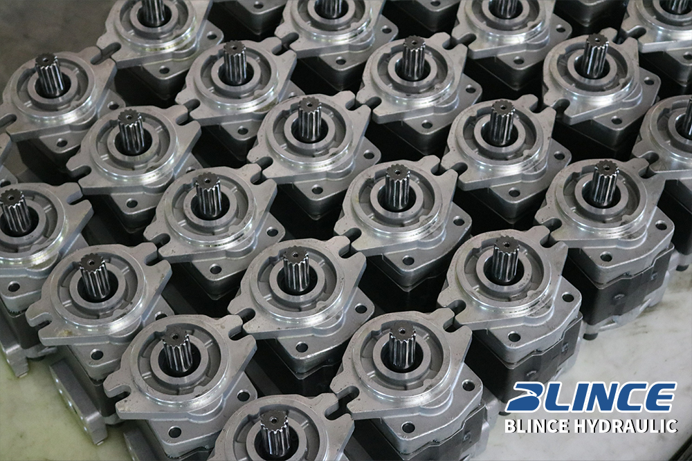 Finished hydraulic gear pump units arranged in batches for inspection and delivery to equipment manufacturers.