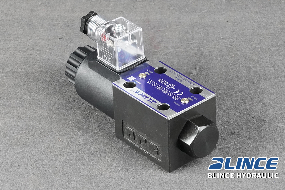 Technician testing solenoid coil voltage and hydraulic pressure during an intermittent valve fault